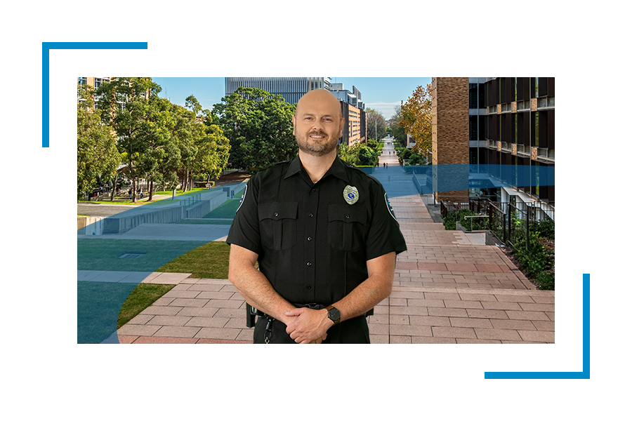 Armed security officer in black unifirm