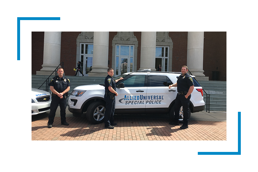 Police officers near allied universal car